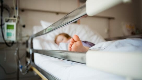 Pediatric hospitalization, child in hospital bed
