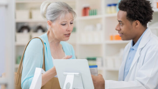 Patient talking to pharmacist